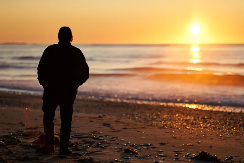 Looking at the sunrise, Point Michaud Beach, Nova Scotia, Canada